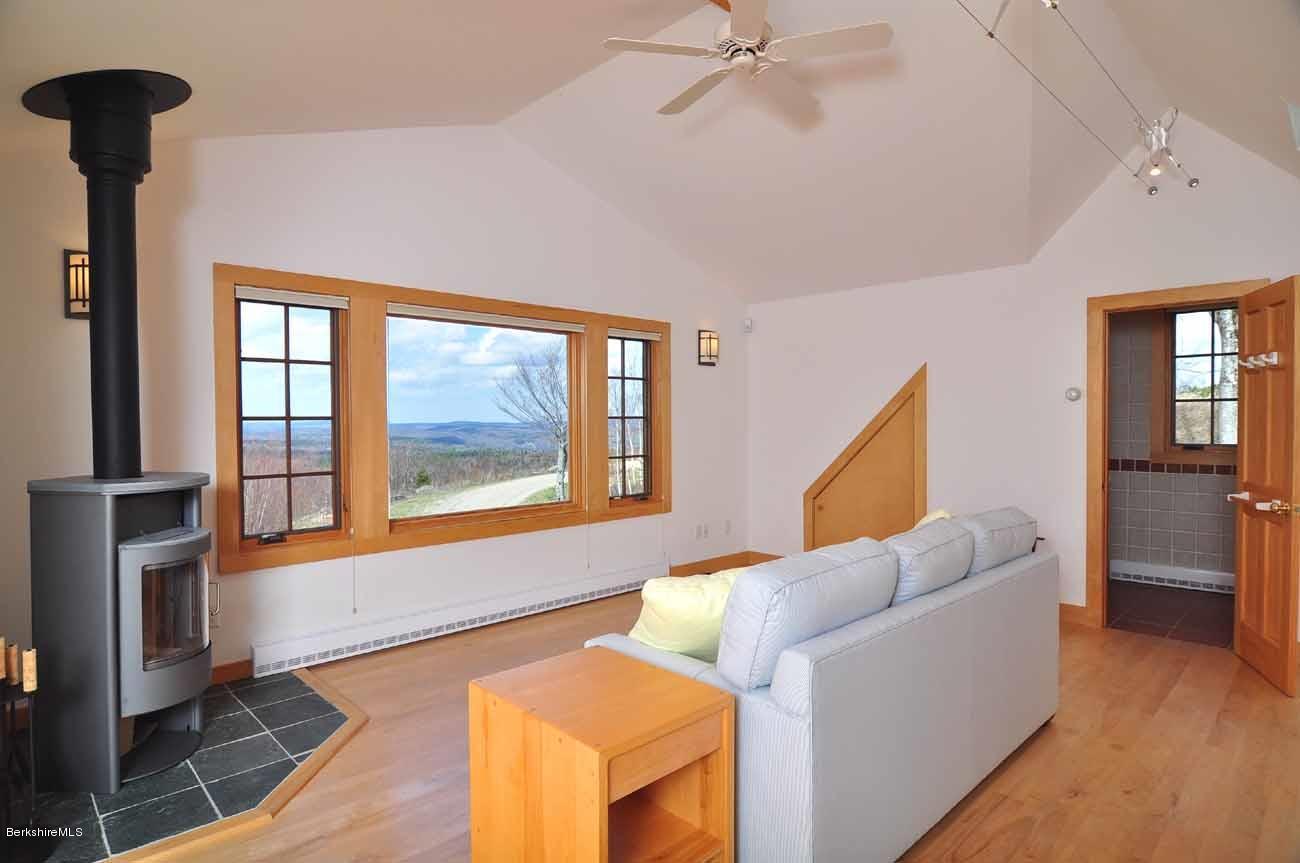 381 Leonhardt Road Becket, MA 01223 - Photo 30 of 47 a living room with furniture and a window