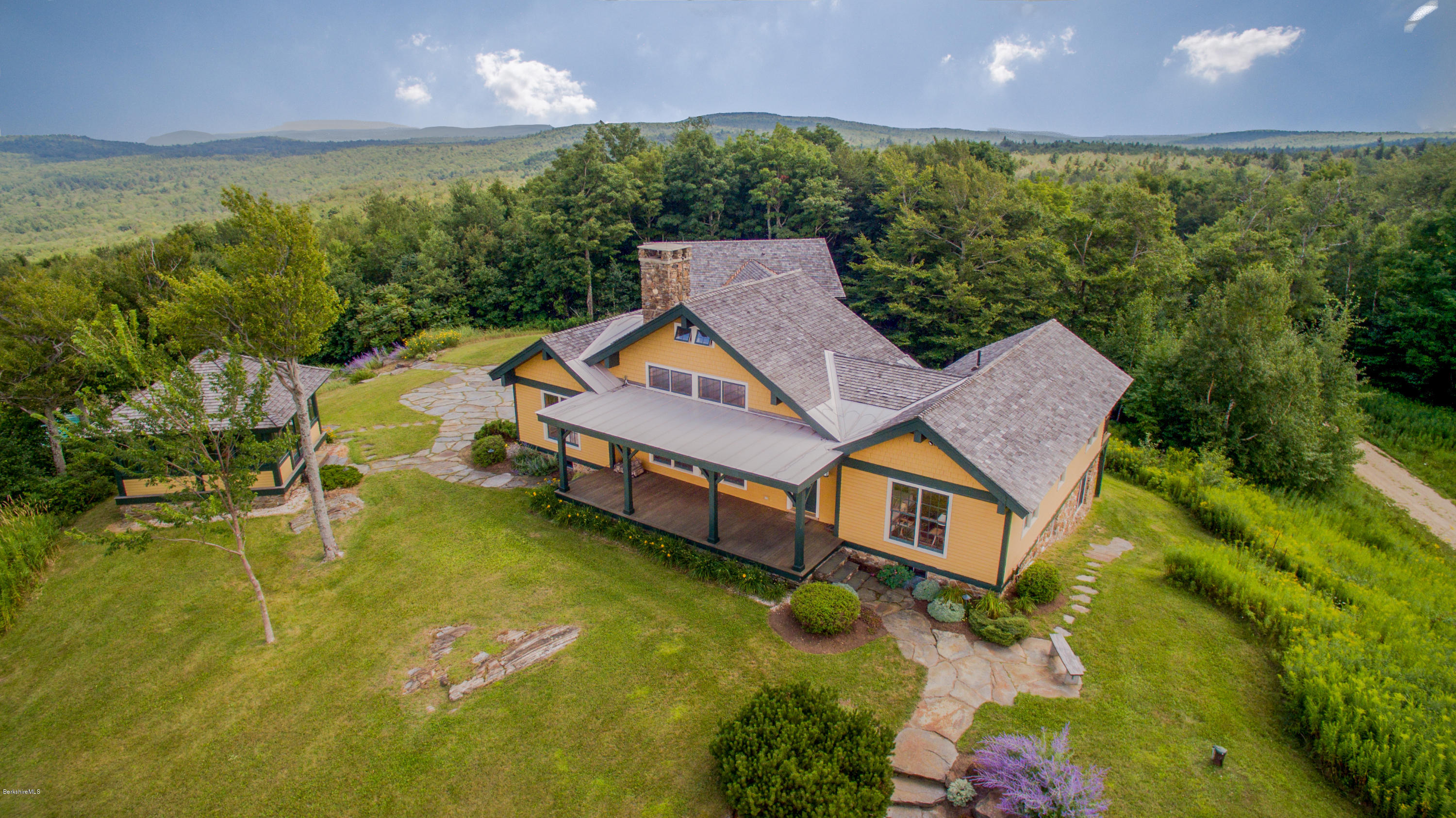 381 Leonhardt Road Becket, MA 01223 - Photo 4 of 47 a aerial view of a house with swimming pool and large trees