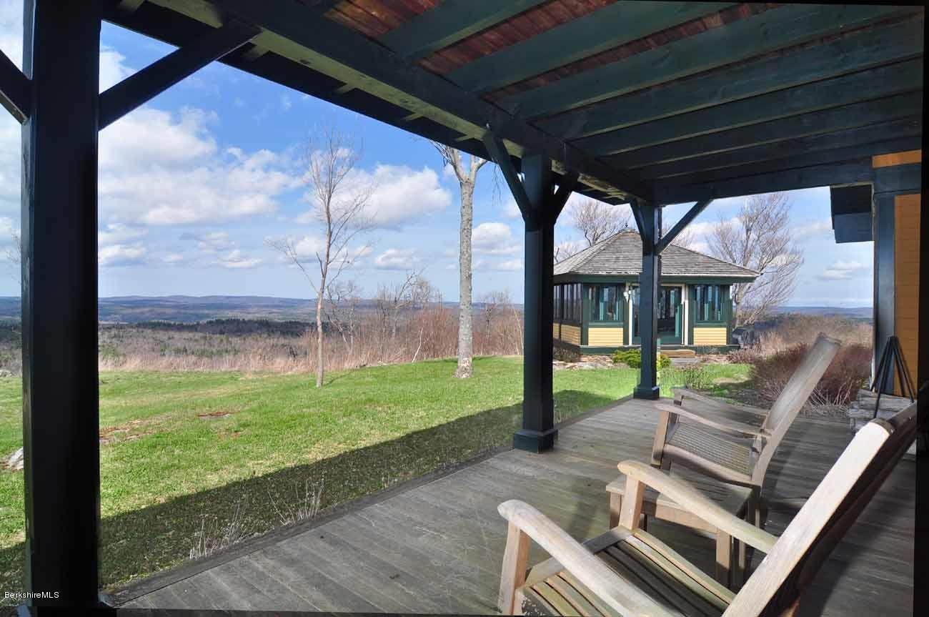 381 Leonhardt Road Becket, MA 01223 - Photo 33 of 47 a view of a porch with furniture and a yard