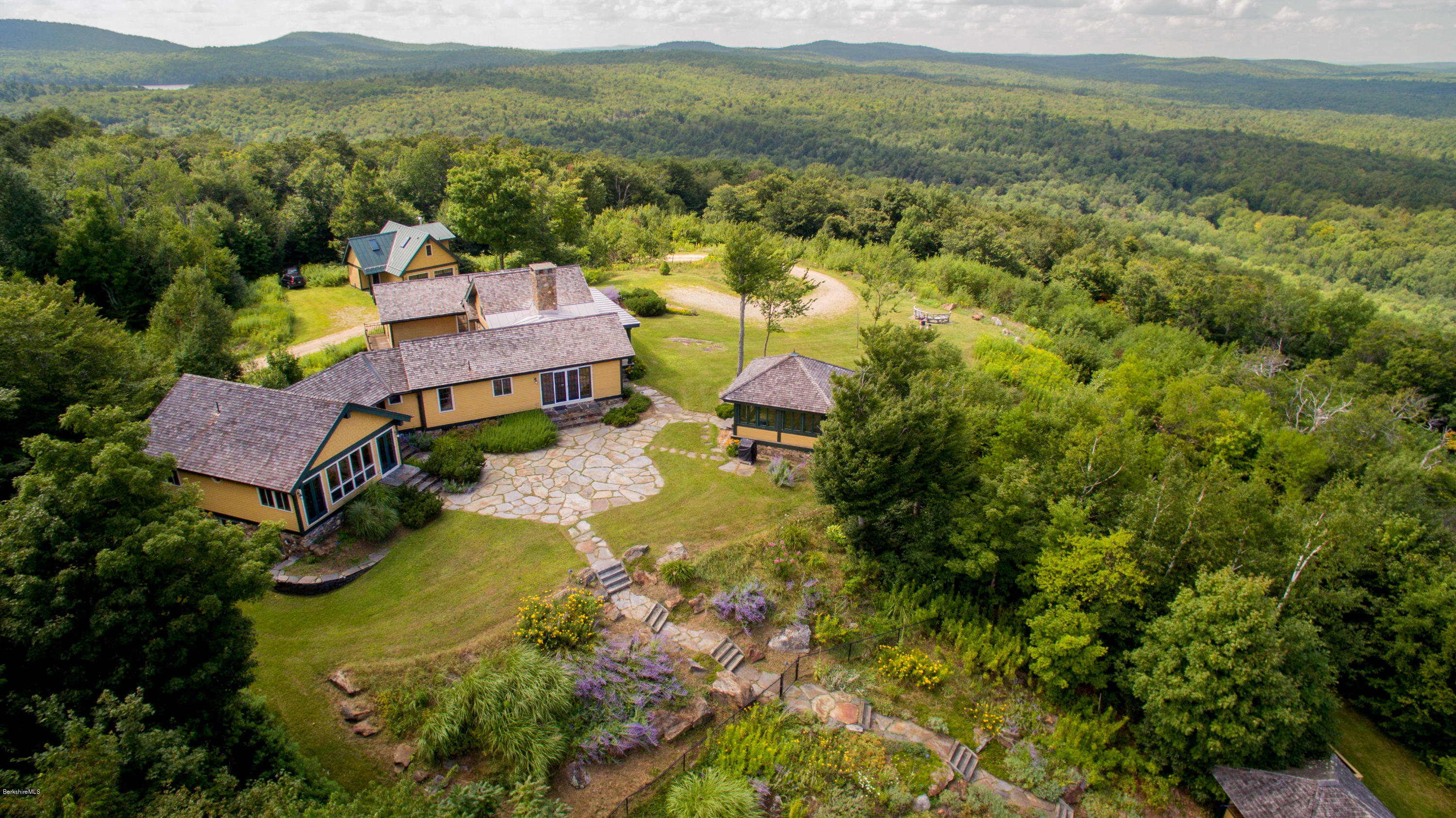 381 Leonhardt Road Becket, MA 01223 - Photo 5 of 47 an aerial view of a house with a garden