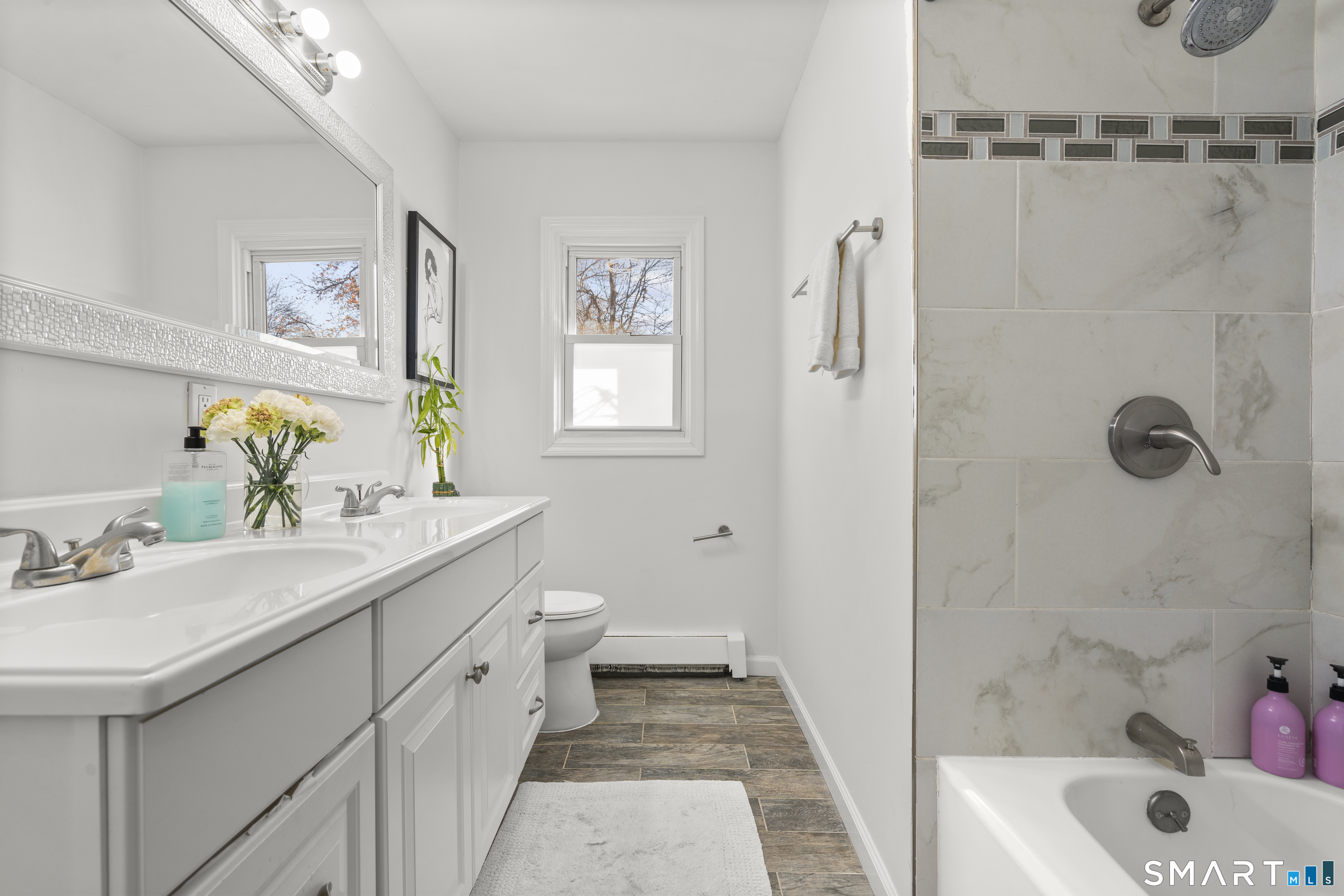 342 West Spring Street West Haven, CT 06516 - Photo 15 of 30 a bathroom with a sink a toilet and shower
