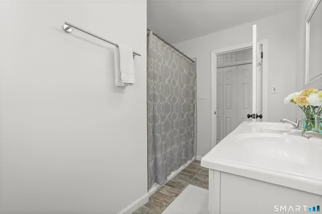a bathroom with a sink and shower
