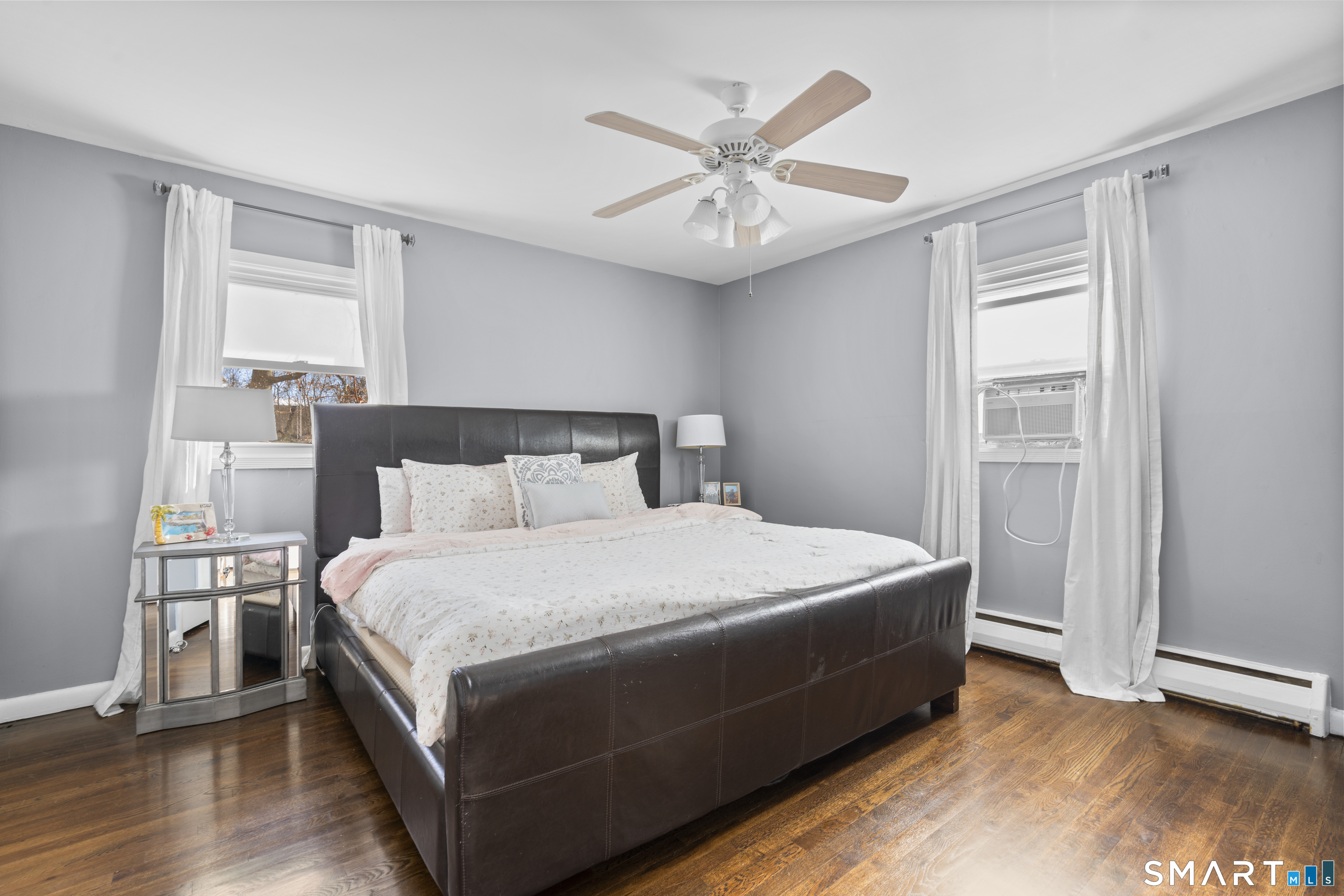 342 West Spring Street West Haven, CT 06516 - Photo 17 of 30 a bedroom with a large bed and a chandelier