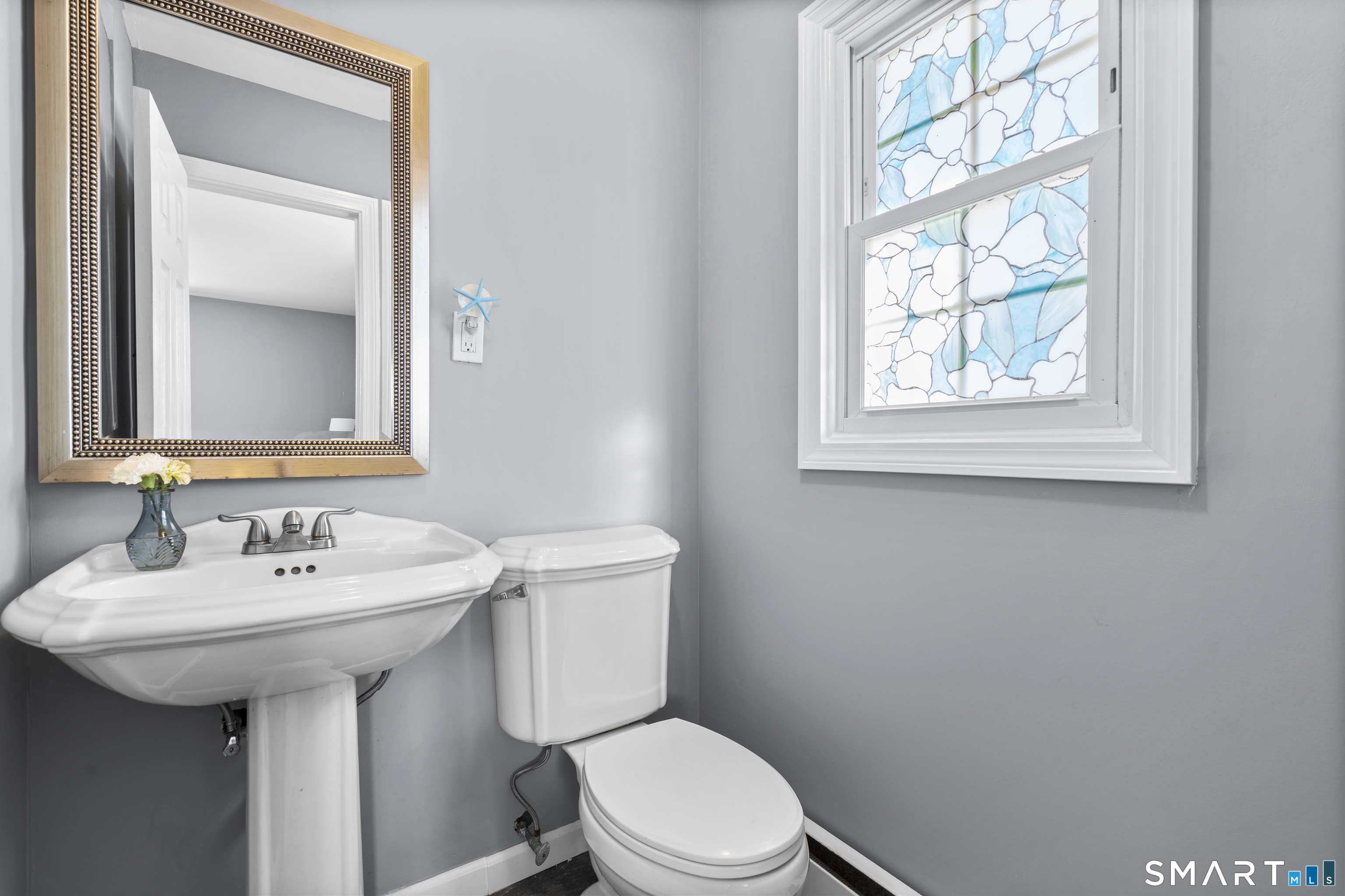 342 West Spring Street West Haven, CT 06516 - Photo 19 of 30 a bathroom with a toilet sink and mirror