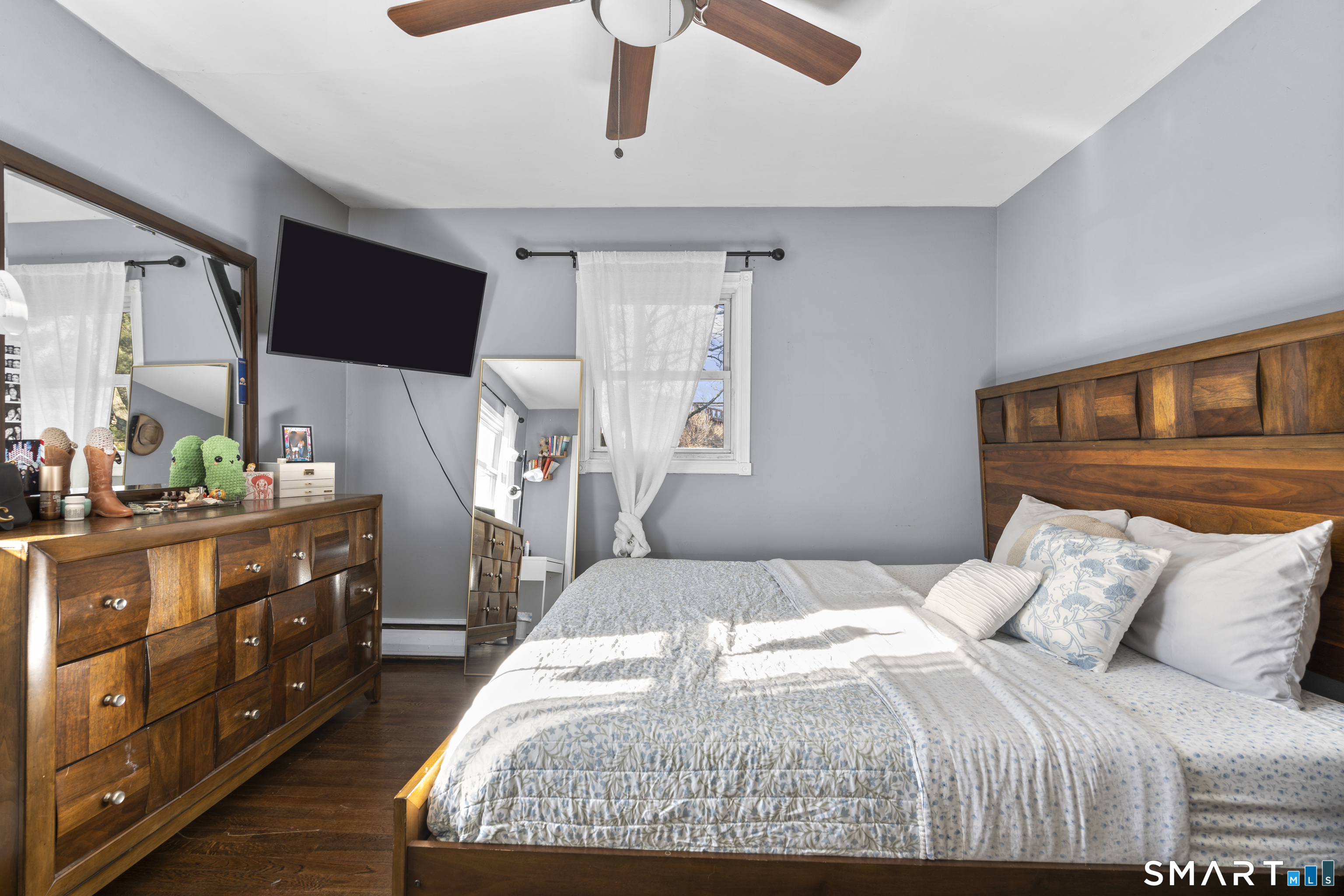342 West Spring Street West Haven, CT 06516 - Photo 20 of 30 a bedroom with a large bed and a flat tv screen on dresser