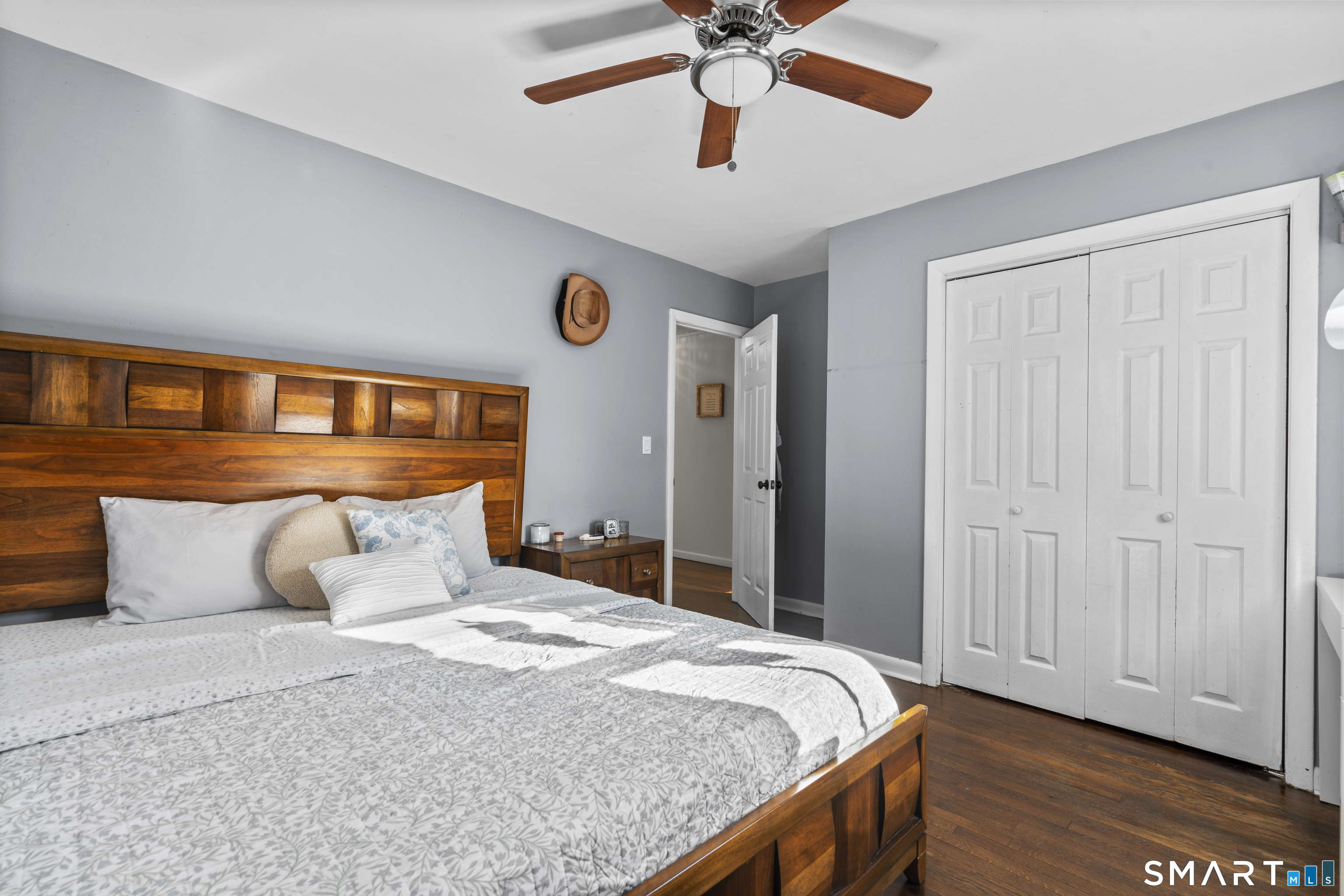 342 West Spring Street West Haven, CT 06516 - Photo 21 of 30 a bedroom with a bed and a chandelier