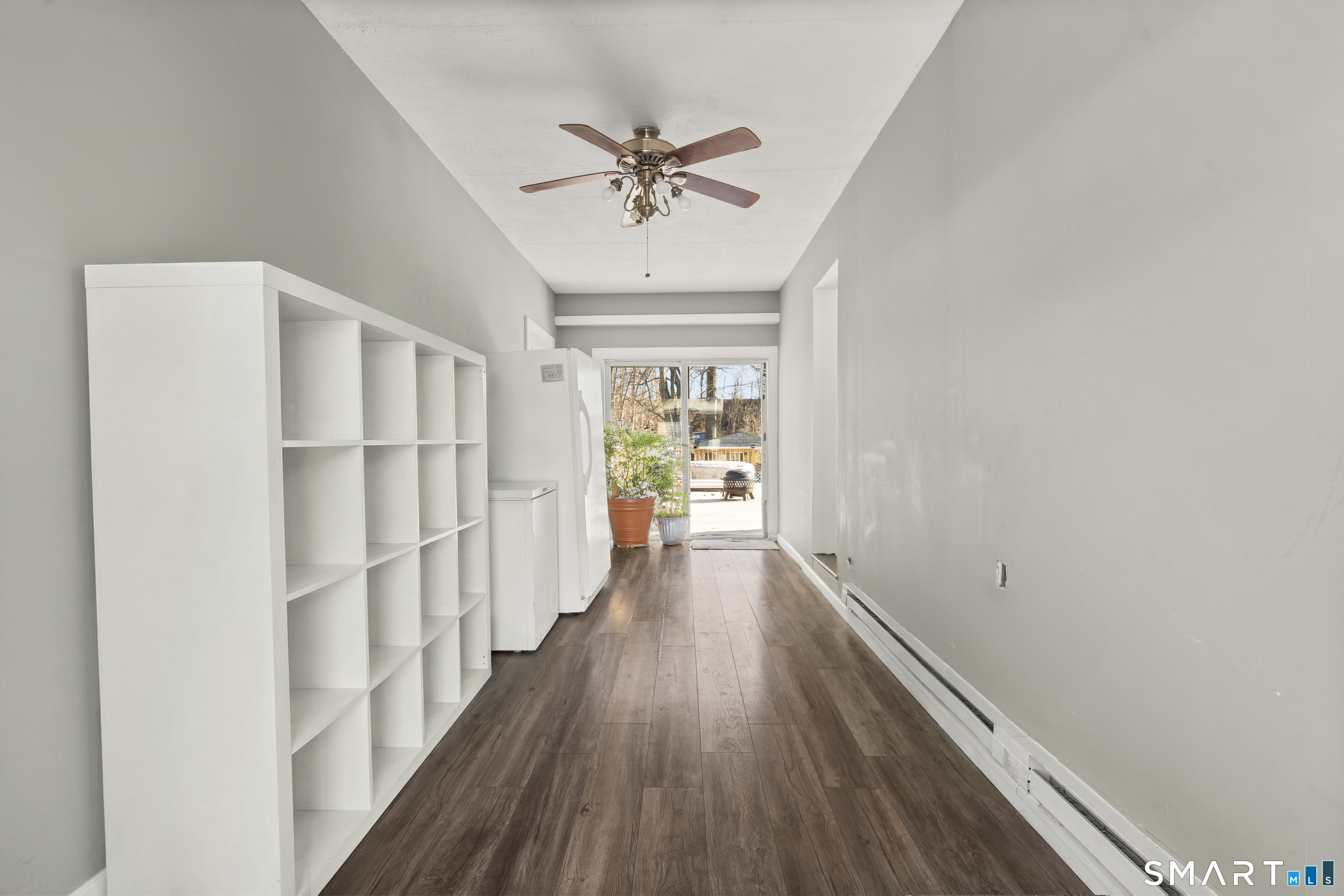 342 West Spring Street West Haven, CT 06516 - Photo 24 of 30 a view of a hallway with wooden floor and a chandelier