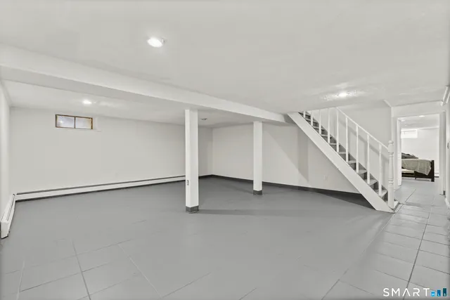 a view of an empty room with stairs