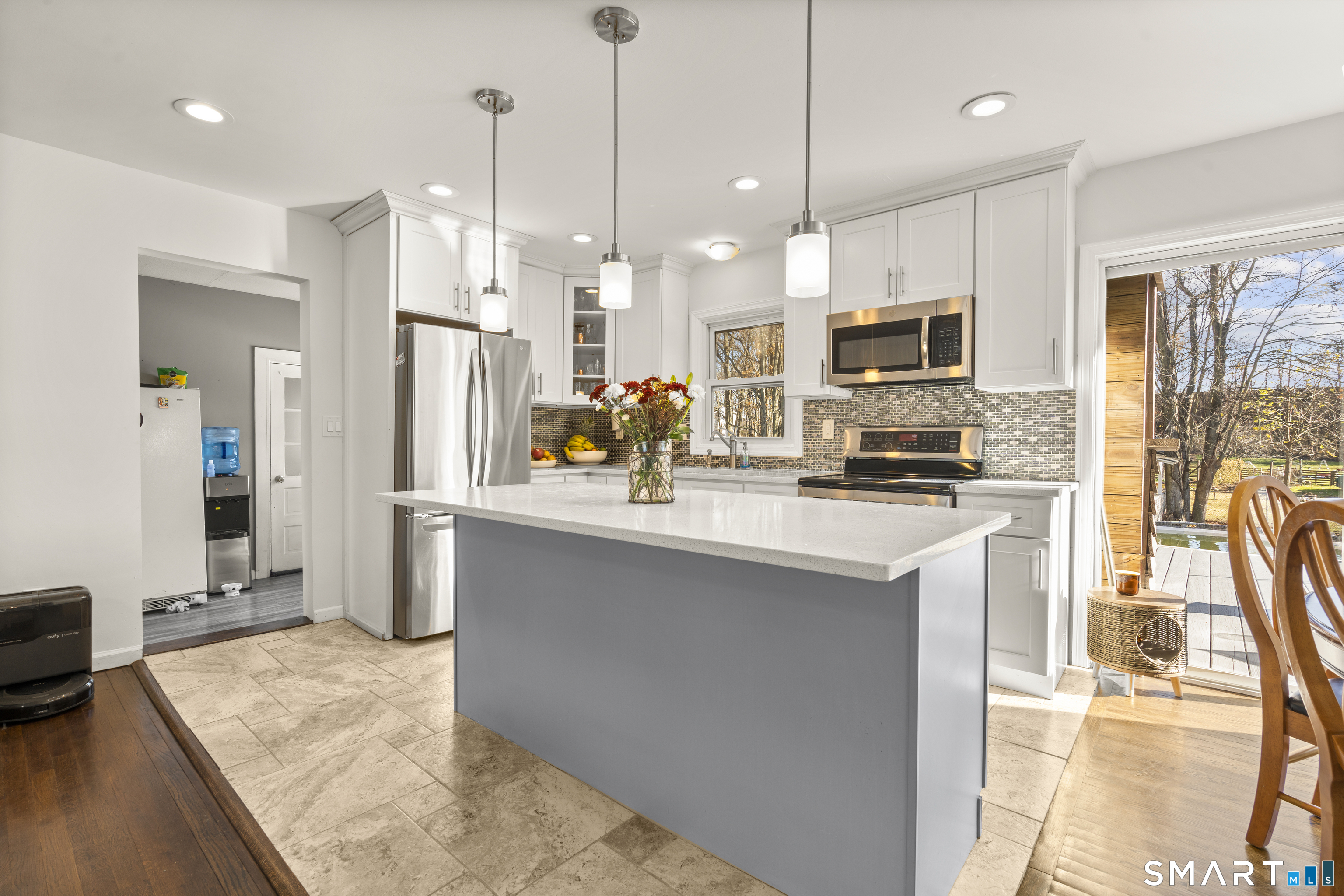 342 West Spring Street West Haven, CT 06516 - Photo 7 of 30 a kitchen with stainless steel appliances kitchen island granite countertop a refrigerator a sink a stove and oven with wooden floor