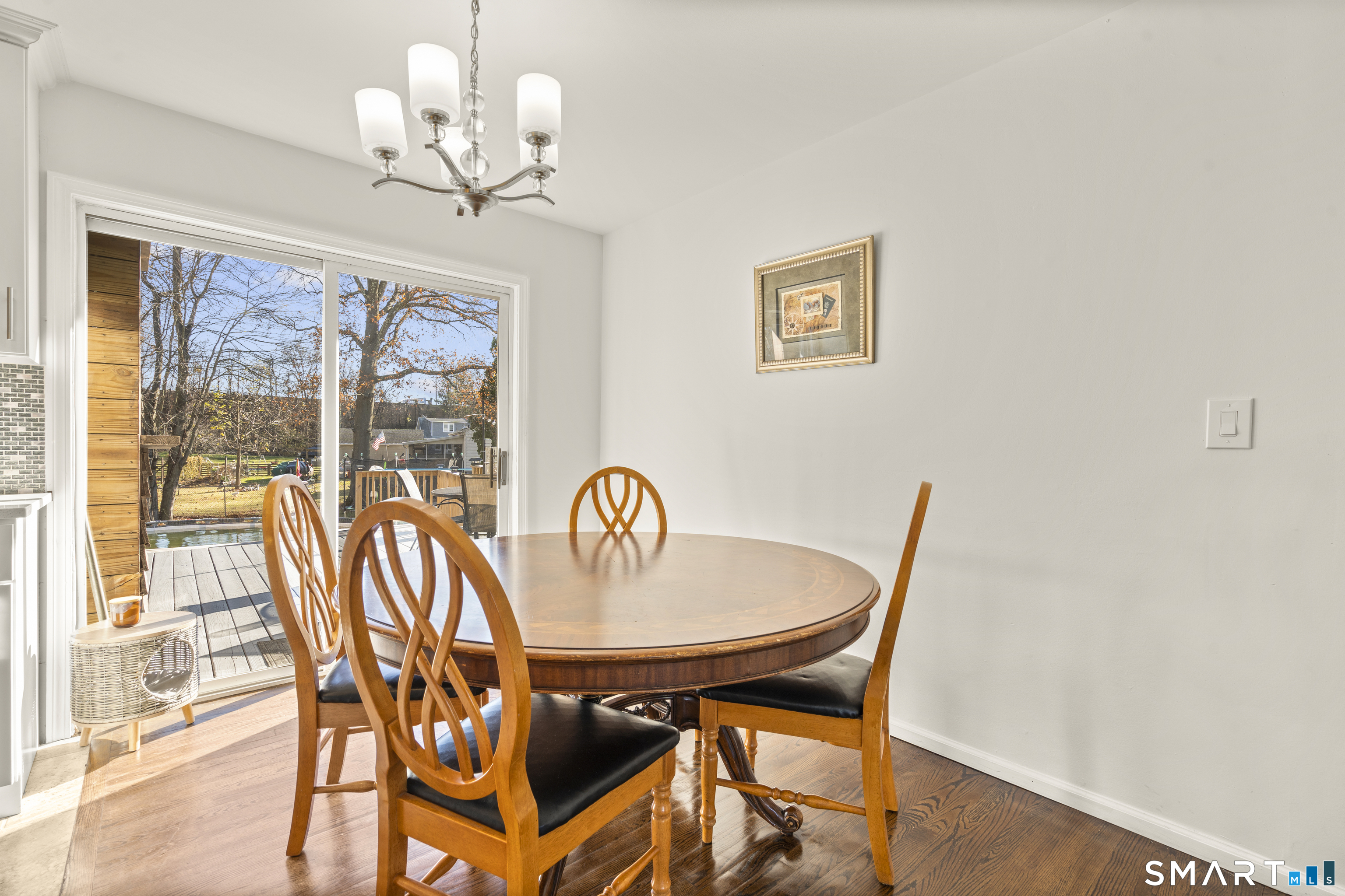 342 West Spring Street West Haven, CT 06516 - Photo 9 of 30 a view of a dining room with furniture wooden floor and chandelier