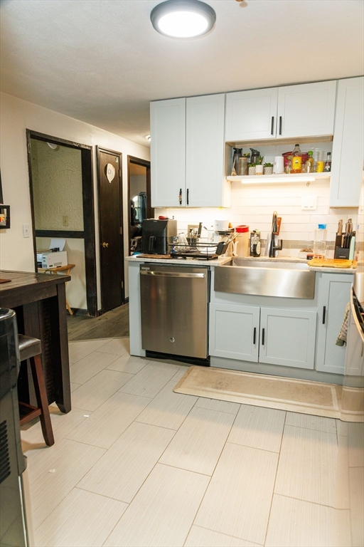 50 Spencer Road, Unit 36L Boxborough, MA 01719 - Photo 11 of 15 a kitchen with stainless steel appliances granite countertop a sink and cabinets