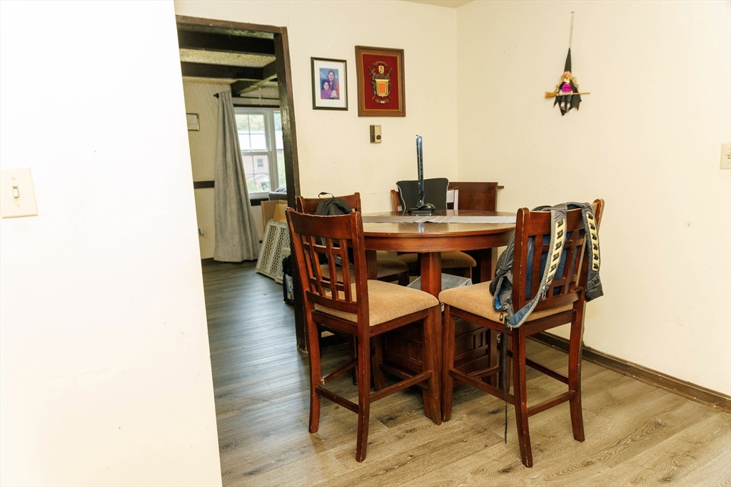 50 Spencer Road, Unit 36L Boxborough, MA 01719 - Photo 3 of 15 a view of a dining room with furniture and wooden floor