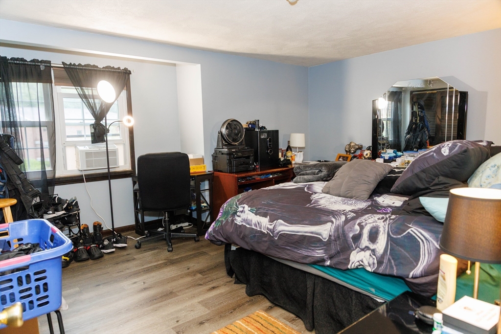 50 Spencer Road, Unit 36L Boxborough, MA 01719 - Photo 7 of 15 a bedroom with bed and glass door