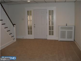 318 Hampden Road Upper Darby, PA 19082 - Photo 2 of 3 a view of an empty room with a window