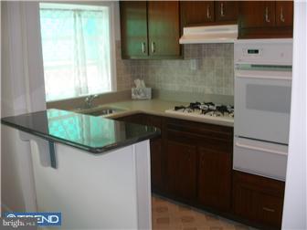 318 Hampden Road Upper Darby, PA 19082 - Photo 3 of 3 a kitchen with a sink and cabinets