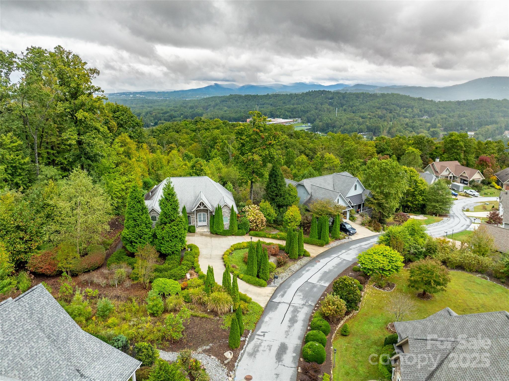 332 Millbrae Loop Hendersonville, NC 28791 - Photo 11 of 14 a view of a garden with lawn chairs