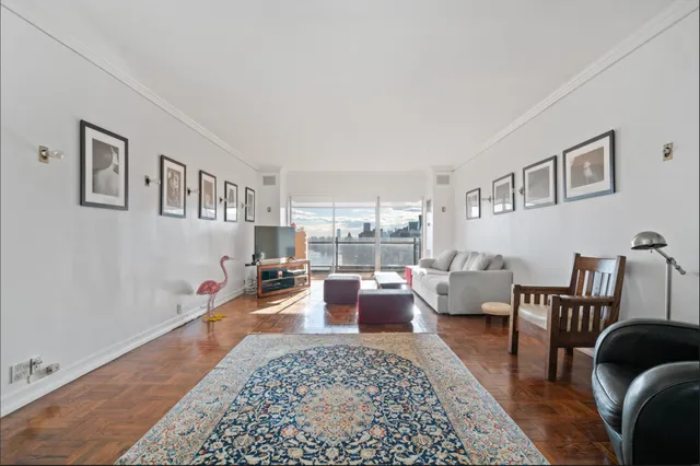a living room with furniture and a rug