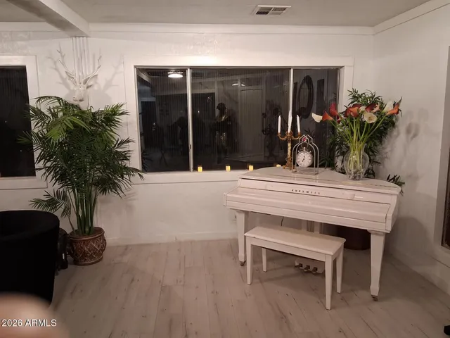 a view of a house with a porch and furniture