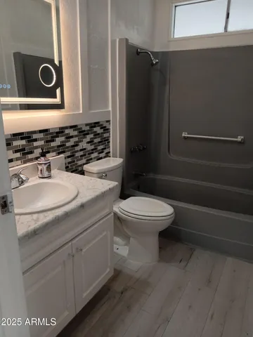 a bathroom with a toilet and a sink