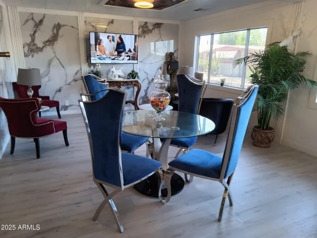 a view of a dining room with furniture window and outside view