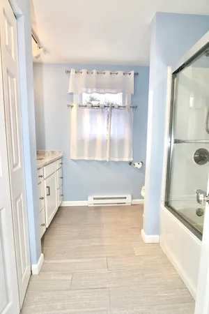 a view of bathroom with bathtub and shower