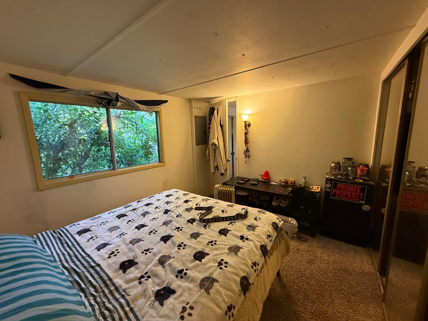 21614 Rockaway Road Nevada City, CA 95959 - Photo 15 of 56 a bedroom with a bed and a window