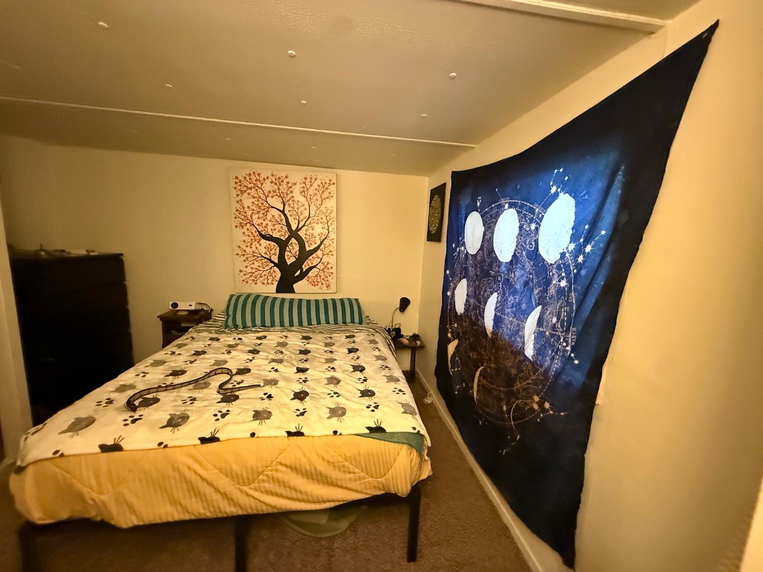 21614 Rockaway Road Nevada City, CA 95959 - Photo 16 of 56 a bedroom with a bed and a wall painting