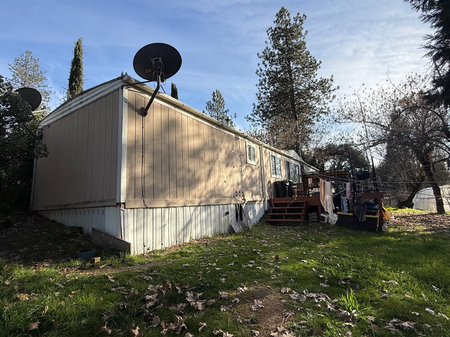 21614 Rockaway Road Nevada City, CA 95959 - Photo 4 of 56 a backyard of a house with a yard and outdoor seating