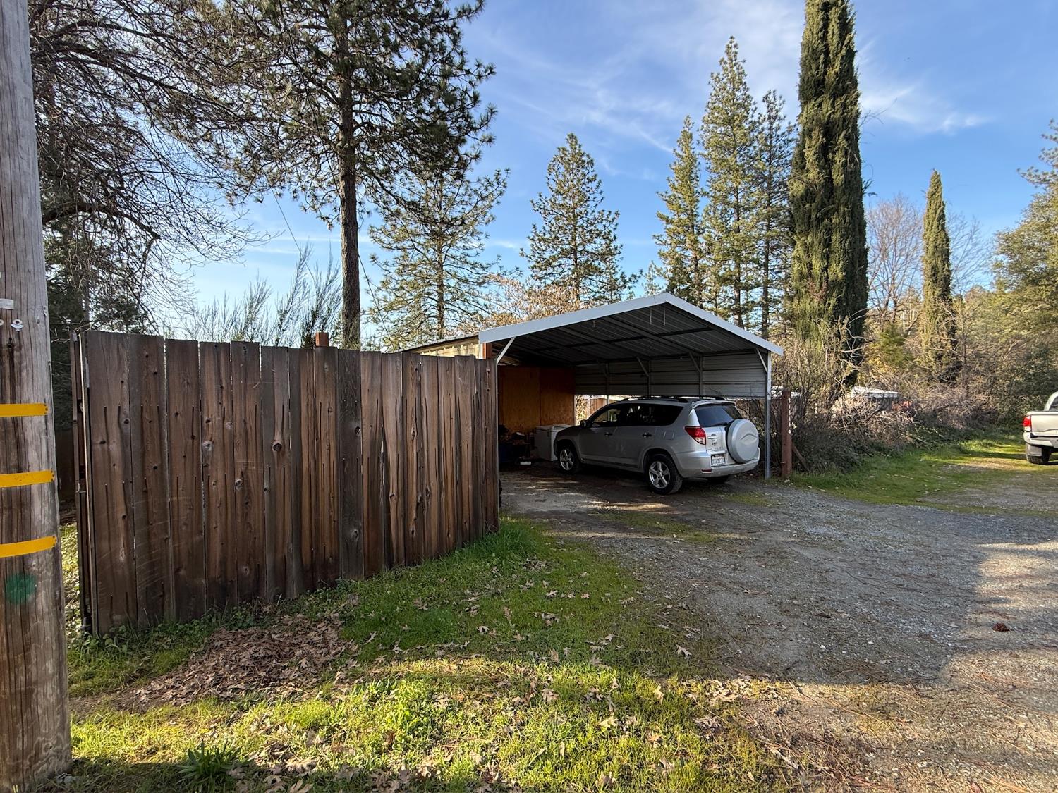 21614 Rockaway Road Nevada City, CA 95959 - Photo 56 of 56 a view of a house with a cars parked in a yard