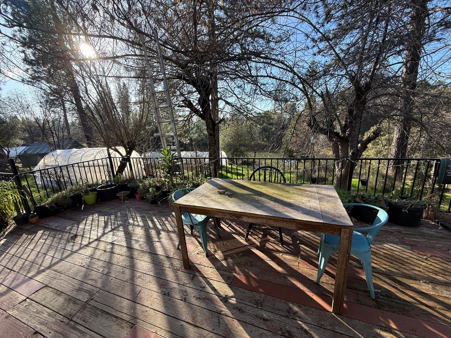 21614 Rockaway Road Nevada City, CA 95959 - Photo 10 of 56 a view of a wooden deck with furniture