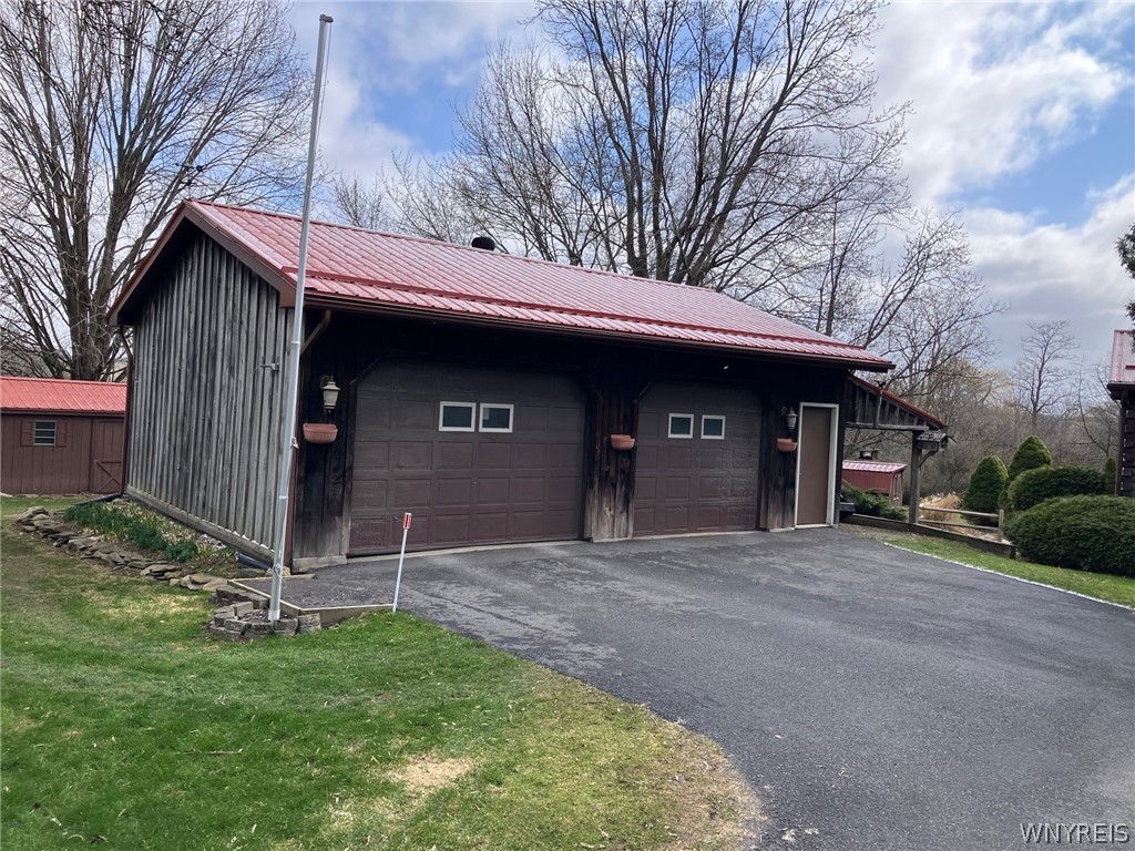 3261 Bacon Road Perry, NY 14530 - Photo 25 of 33 2 car garage with additional storage