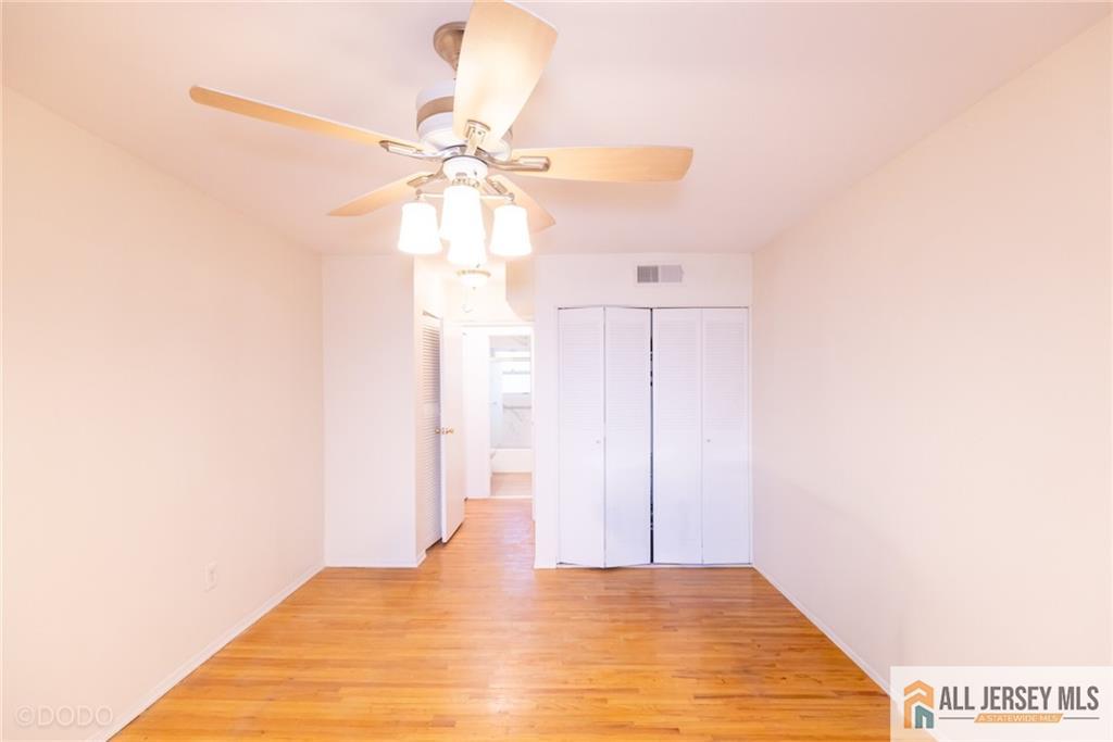 187 Evergreen Road, Unit 4B Edison, NJ 08837 - Photo 8 of 8 a view of a room with a ceiling fan
