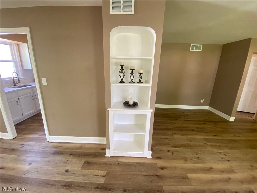 2508 Greenvale Road Cleveland, OH 44121 - Photo 7 of 16 Corridor with sink and hardwood / wood-style floors
