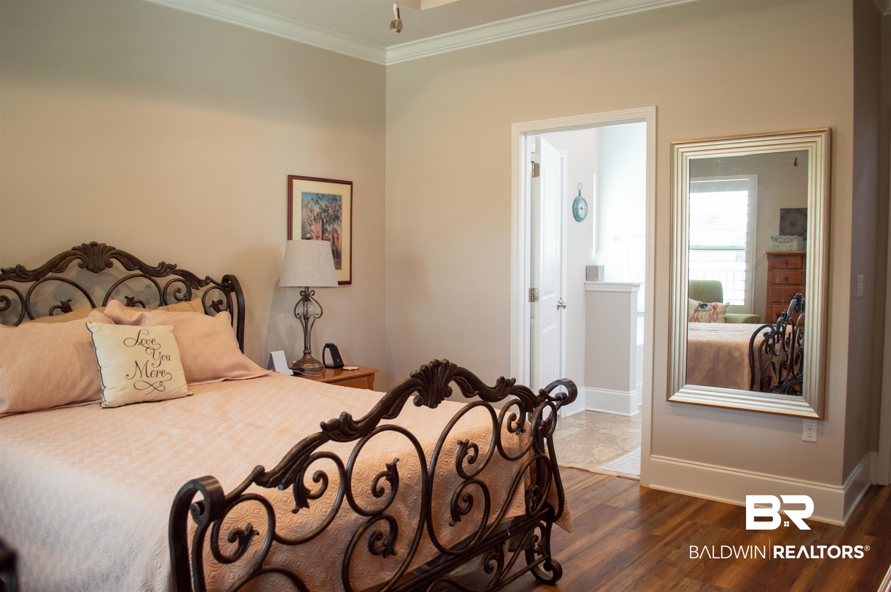 1124 West Orlando Drive Foley, AL 36535 - Photo 19 of 51 Bedroom with ornamental molding, dark wood-type flooring, and connected bathroom