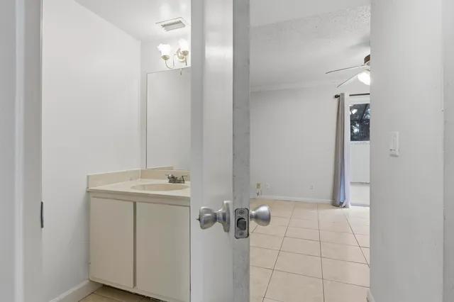 a bathroom with a sink and mirror