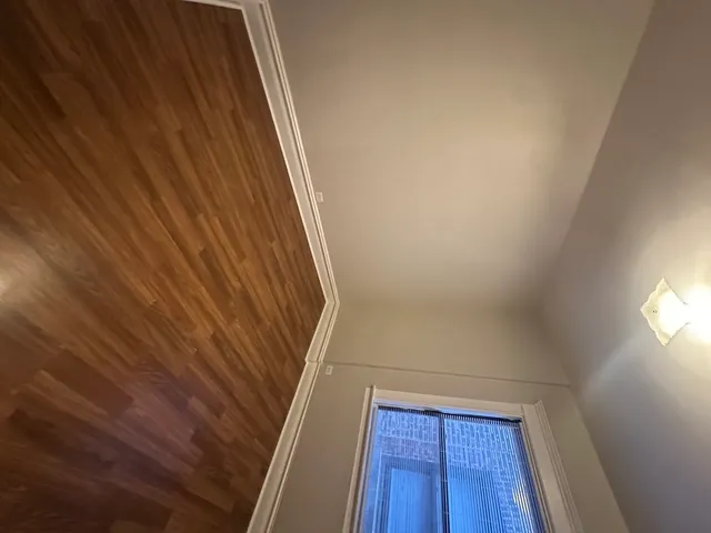 a view of balcony with wooden floor