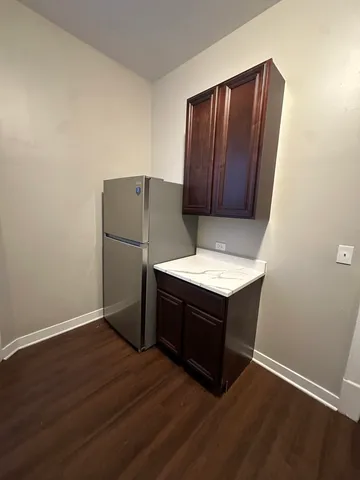 a kitchen with wooden cabinets and a sink