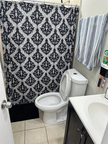 a bathroom with a toilet and a sink
