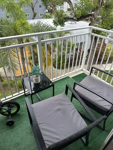 a view of a two chairs in the patio