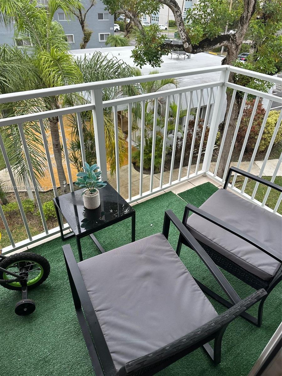 11301 Southwest 200th Street, Unit 305A Miami, FL 33157 - Photo 23 of 26 a view of a two chairs in the patio