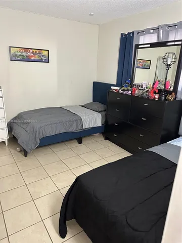 a bedroom with a bed and a table