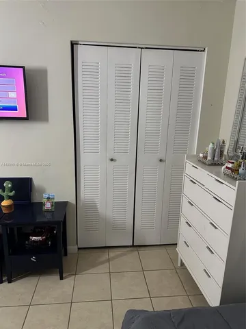 a room with a dresser and a mirror