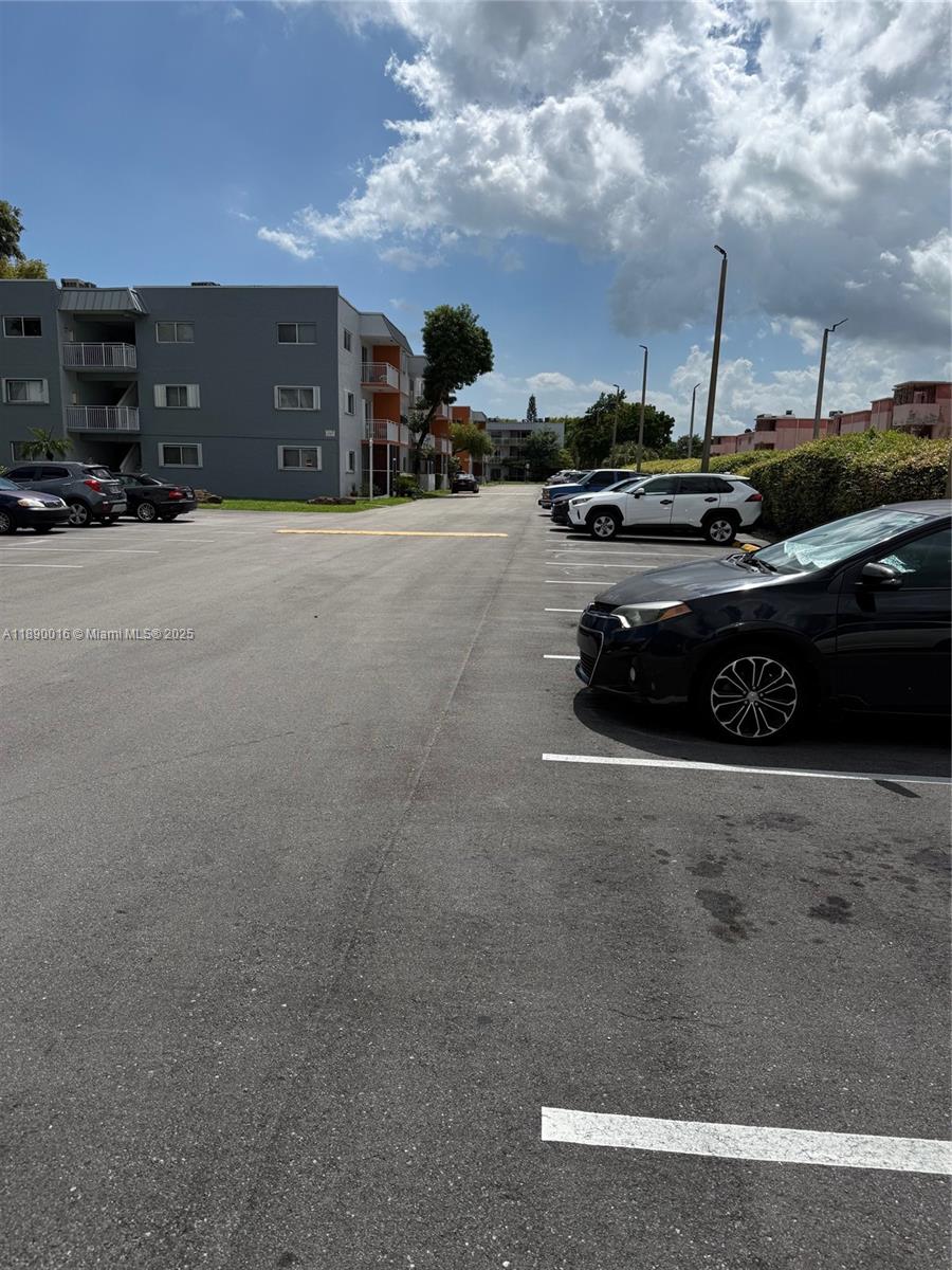 11301 Southwest 200th Street, Unit 305A Miami, FL 33157 - Photo 3 of 26 a car parked on the side of the road
