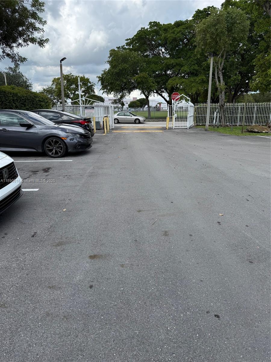 11301 Southwest 200th Street, Unit 305A Miami, FL 33157 - Photo 6 of 26 a view of street with cars