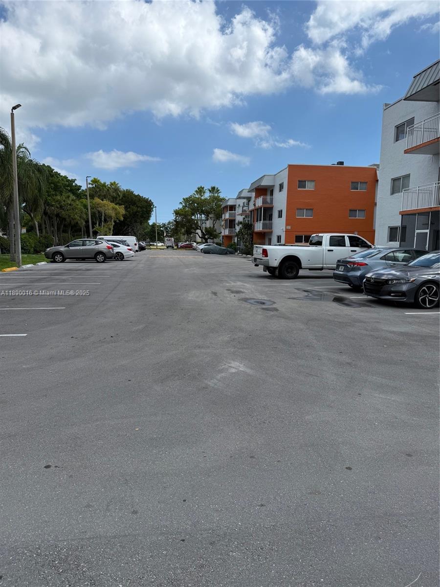 11301 Southwest 200th Street, Unit 305A Miami, FL 33157 - Photo 9 of 26 a view of street with cars