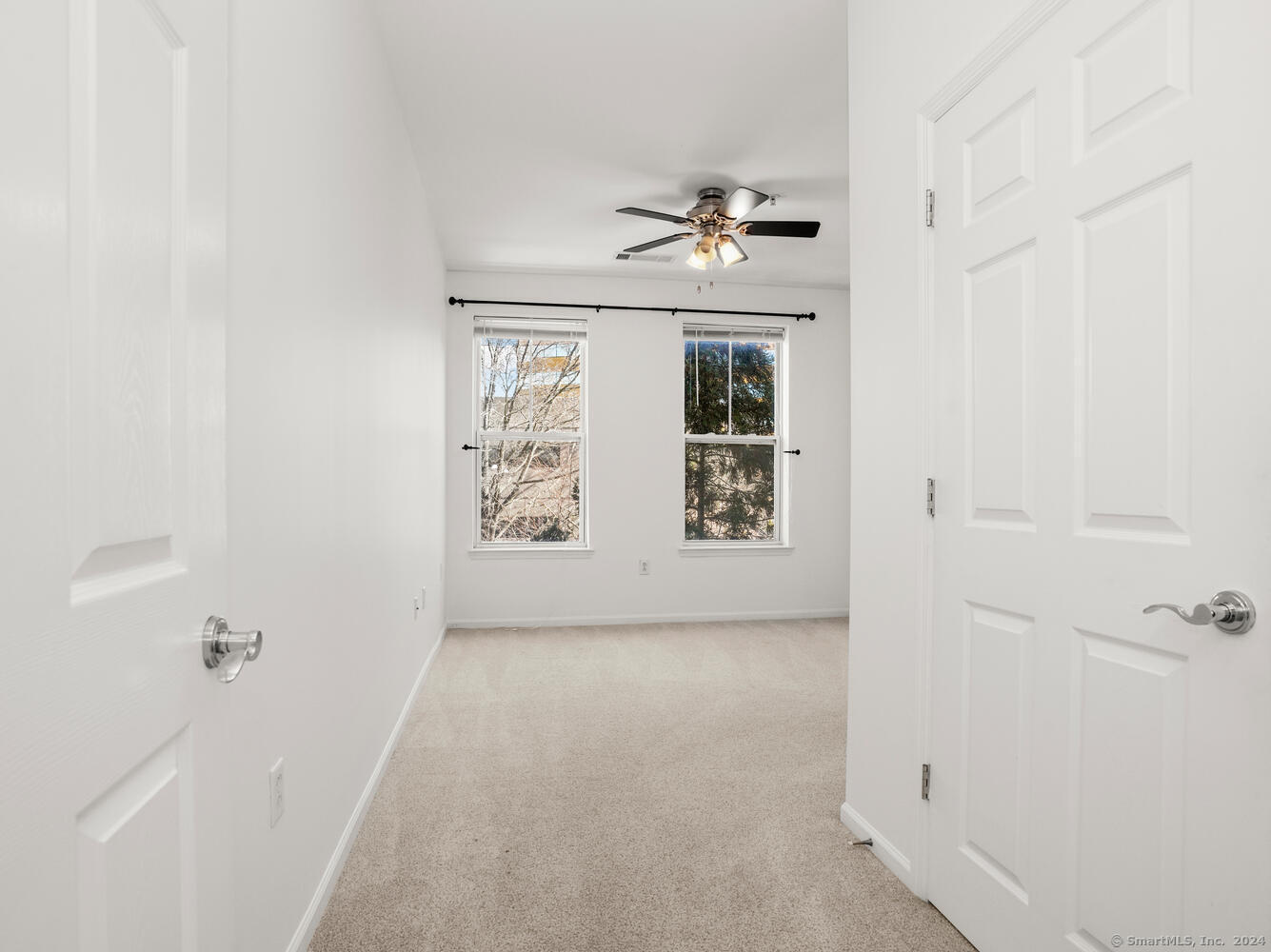 35 West Broad Street, Unit 211 Stamford, CT 06902 - Photo 17 of 38 a view of room with window and ceiling fan