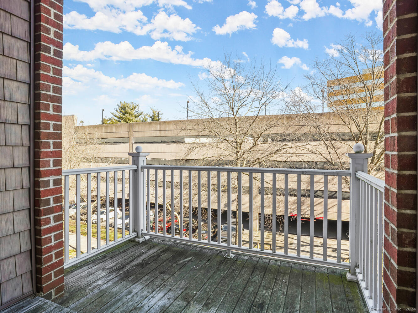 35 West Broad Street, Unit 211 Stamford, CT 06902 - Photo 23 of 38 a view of a balcony with wooden fence