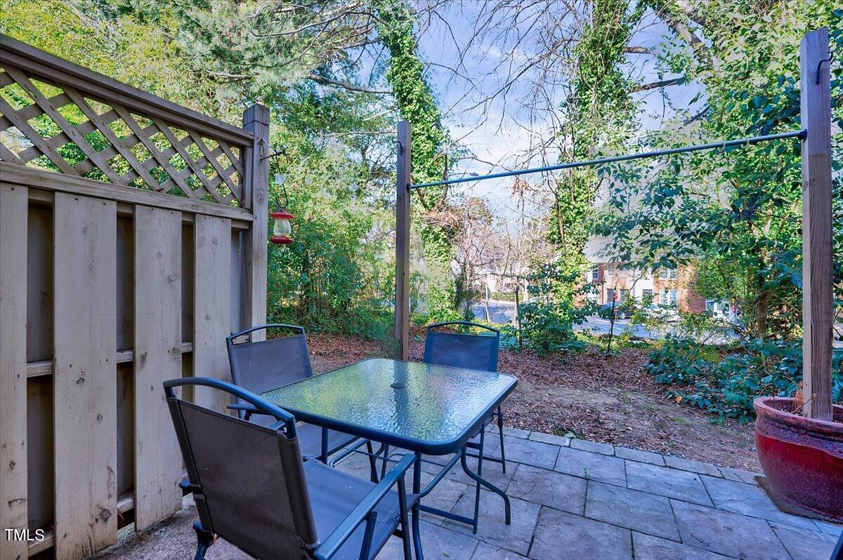 4808 Blue Bird Court, Unit D Raleigh, NC 27606 - Photo 24 of 31 a view of a outdoor seating area