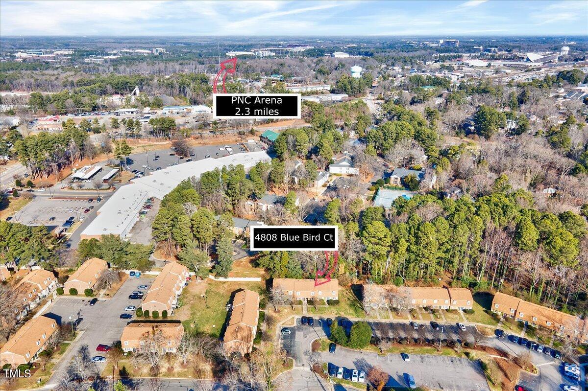 4808 Blue Bird Court, Unit D Raleigh, NC 27606 - Photo 25 of 31 an aerial view of a city with lots of residential buildings