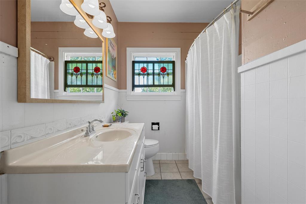 2730 Live Oak Avenue Waco, TX 76708 - Photo 16 of 26 a bathroom with a sink and a mirror